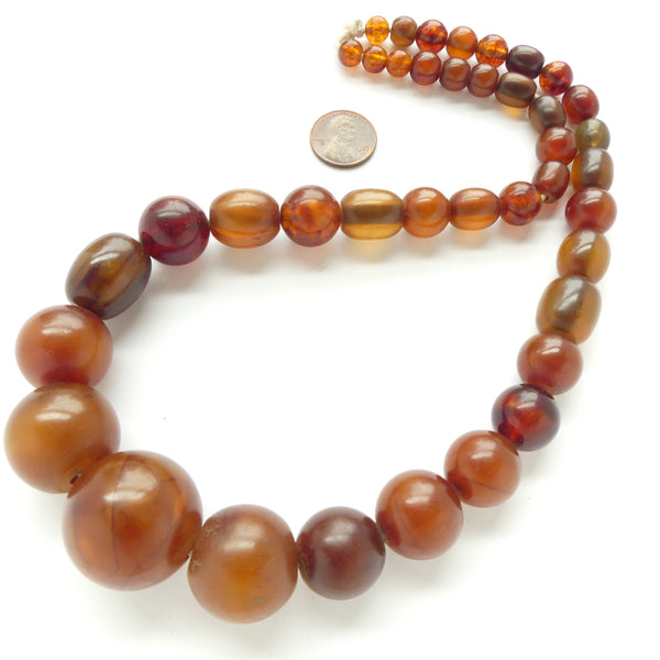 Guinea Amber Strand, Graduated Round and Barrell Shape Beads 8 to 28mm Diameter