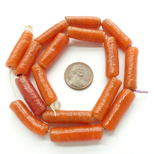 Nigerian Wound Glass Beads, Orange,  27x9mm on 17-inch Strand