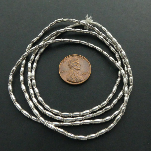 Thai Silver, Collared Mini Rice Shaped 5x1mm Beads on 28-inch Strands