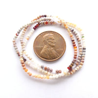 Fire Opal, Faceted Round 1.5mm Beads on 13-inch Strand