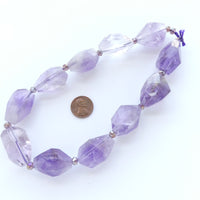 Amethyst Faceted Nuggets 30x20mm on 16-inch Strand