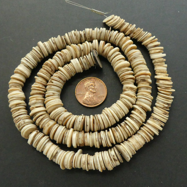 Snail Shell Heishi, 8-10mm Diameter on 23-inch Strand