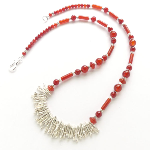 Thai Sterling Silver "Coral" Grounds this 22-inch Carnelian Necklace