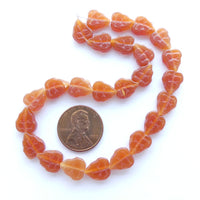 Czech Glass Molded Leaf Shape, Carnelian color, 10x8mm, Strands of 25