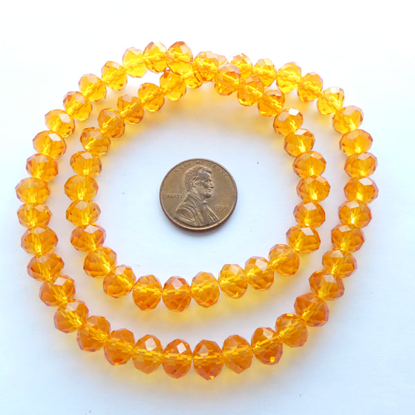 Faceted Glass "Dragon Crystal" 8x10mm, Translucent Orange, 16-inch Strands