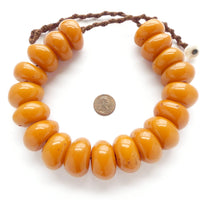 Tibetan Faux Amber, Strand of 19 Beads with Macrame Cord and Shell Button Clasp